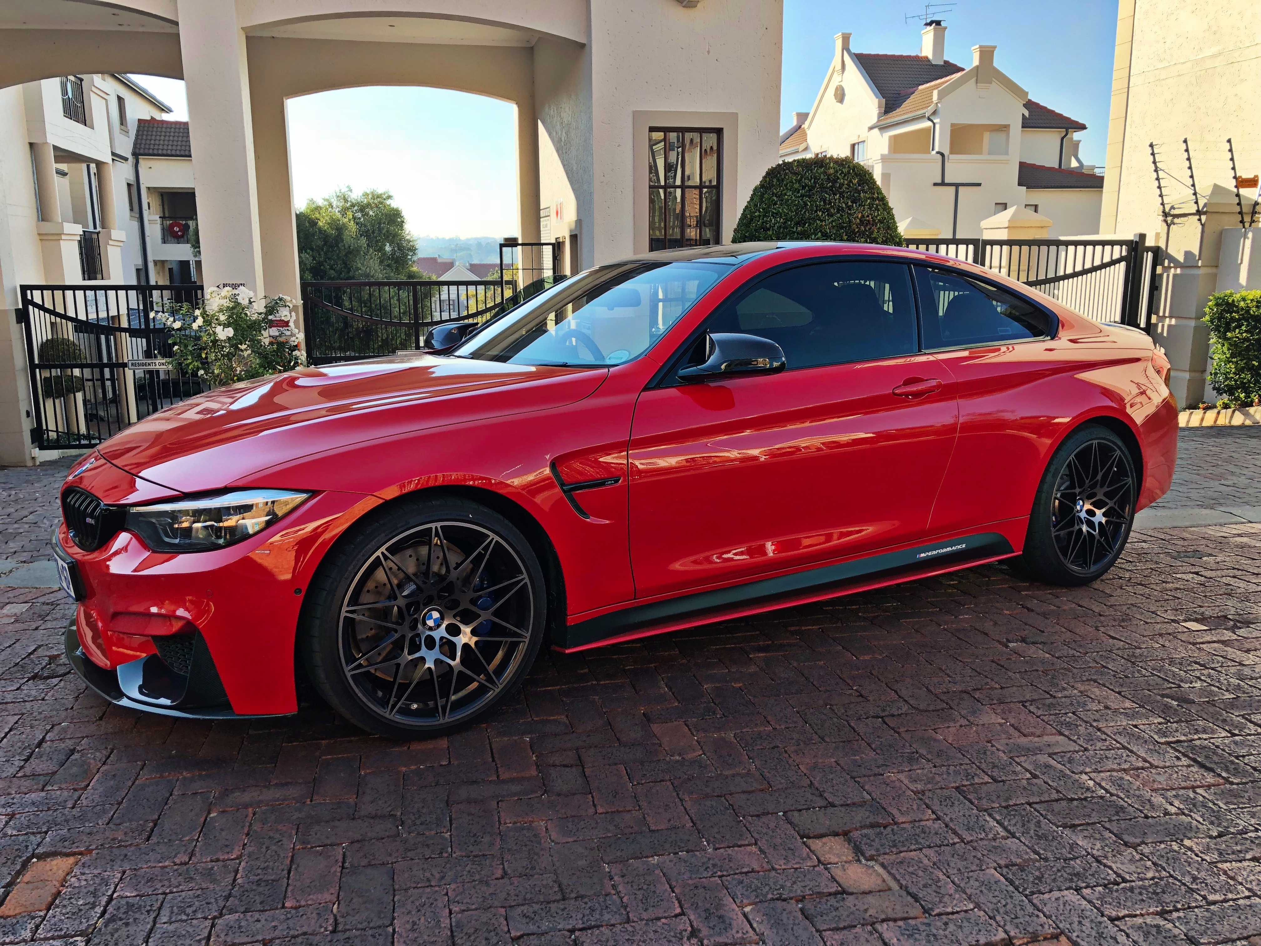 ferrari red bmw m4 competition